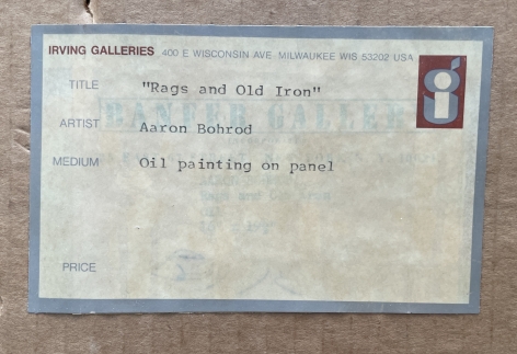 Image of Irving Galleries label verso on Rags and Old Iron painting by Aaron Bohrod.