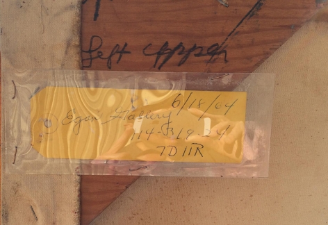 Image of yellow oak tag label from Egan Gallery on the verso of "Untitled Artist's Estate #30" painting by Julius Hatofsky.